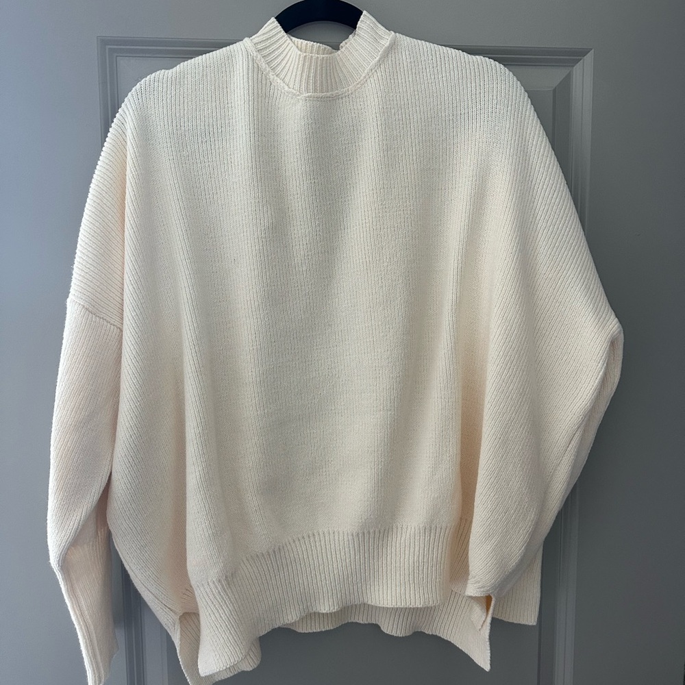 cream vestique sweater